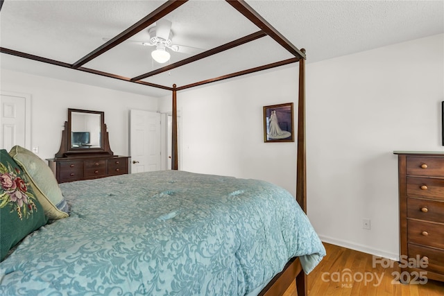 709 Weldon Ln, Salisbury, NC 28146 - bedroom with a ceiling fan, baseboards, and wood finished floors