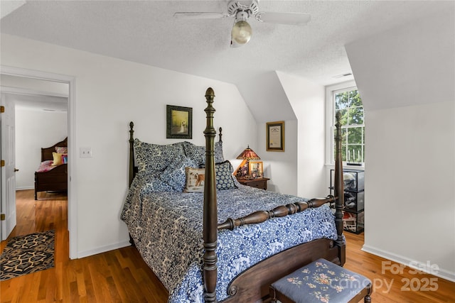 709 Weldon Ln, Salisbury, NC 28146 - bedroom featuring ceiling fan, a textured ceiling, visible vents, vaulted ceiling, and wood finished floors