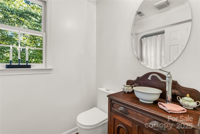 709 Weldon Ln, Salisbury, NC 28146 - bathroom with crown molding, toilet, and vanity