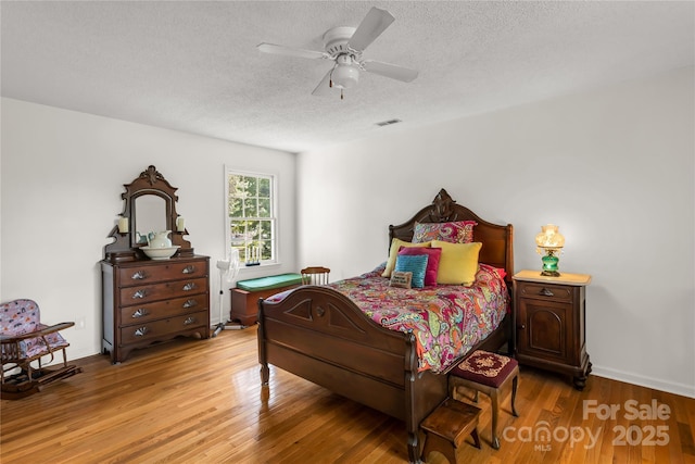 709 Weldon Ln, Salisbury, NC 28146 - bedroom featuring light wood-style floors, a ceiling fan, a textured ceiling, and visible vents