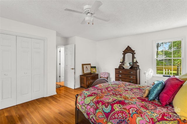 709 Weldon Ln, Salisbury, NC 28146 - bedroom with a textured ceiling, ceiling fan, a closet, and wood finished floors