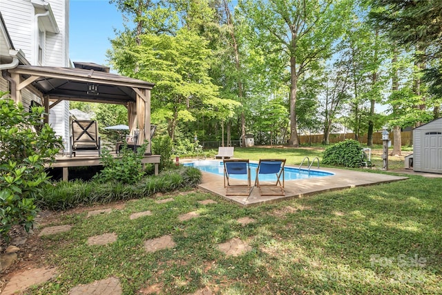 709 Weldon Ln, Salisbury, NC 28146 - view of pool featuring an outdoor structure, a fenced backyard, a shed, a fenced in pool, and a lawn