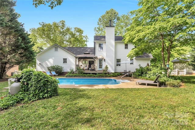 709 Weldon Ln, Salisbury, NC 28146 - rear view of house featuring a lawn, a wooden deck, a gazebo, and a chimney