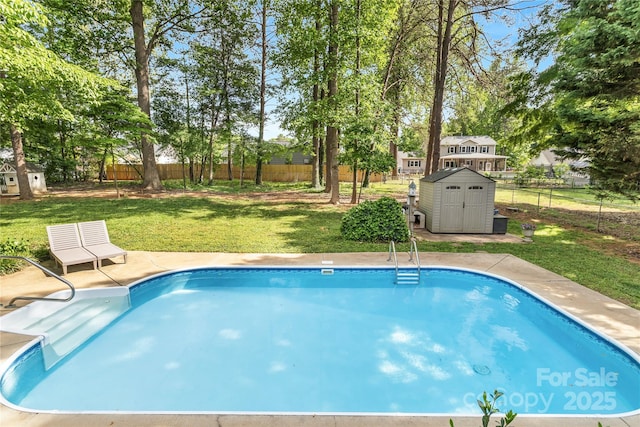 709 Weldon Ln, Salisbury, NC 28146 - view of swimming pool with a lawn, a fenced backyard, a shed, and an outbuilding