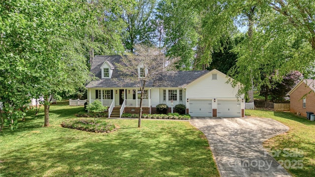 709 Weldon Ln, Salisbury, NC 28146 - new england style home featuring covered porch, a front yard, a garage, fence, and concrete driveway