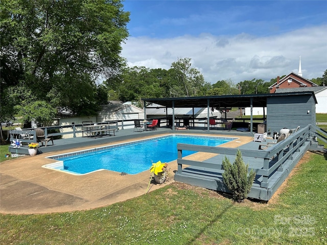 view of pool featuring a fenced in pool, fence, and a patio area
