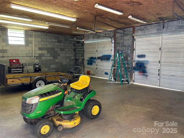 garage with concrete block wall