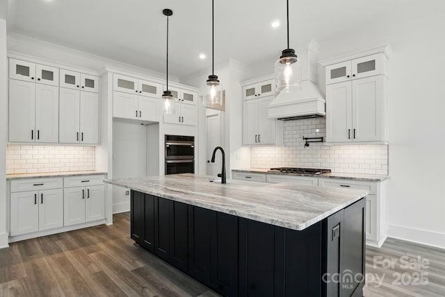 kitchen with baseboards, dark wood-type flooring, white cabinetry, appliances with stainless steel finishes, and backsplash