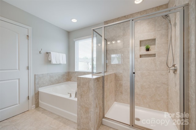 bathroom featuring tile patterned flooring, a shower stall, recessed lighting, and a bath