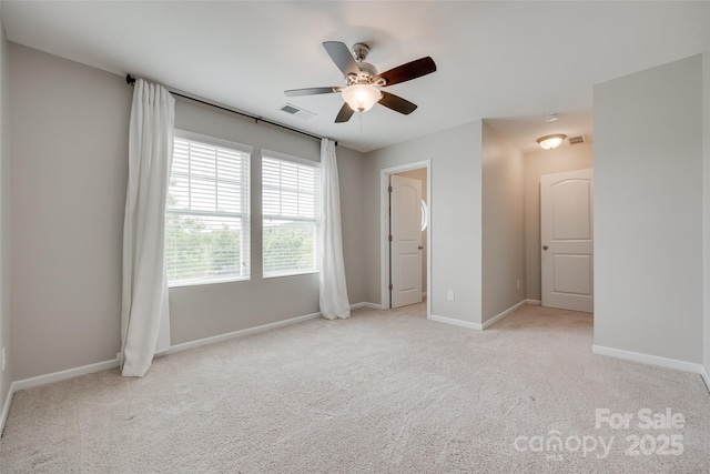 unfurnished bedroom featuring a ceiling fan, baseboards, visible vents, and carpet