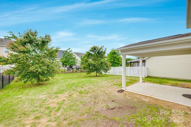 view of yard featuring a patio and fence