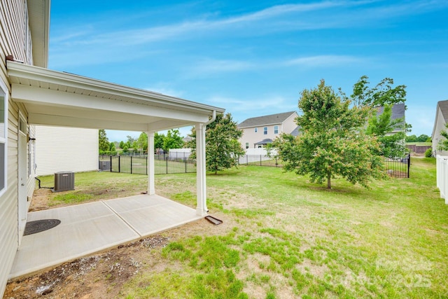 view of yard with central AC unit, a patio area, and a fenced backyard