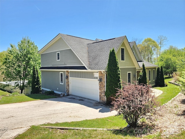 521 Hobson Rd, Bakersville, NC 28705 - view of side of home with driveway, roof with shingles, a garage, stone siding, and board and batten siding