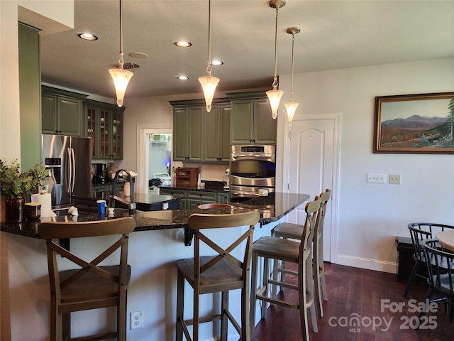 521 Hobson Rd, Bakersville, NC 28705 - kitchen featuring stainless steel appliances, a breakfast bar, recessed lighting, baseboards, and glass insert cabinets