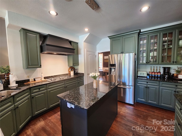 521 Hobson Rd, Bakersville, NC 28705 - kitchen featuring appliances with stainless steel finishes, premium range hood, green cabinetry, dark stone counters, and dark wood-type flooring