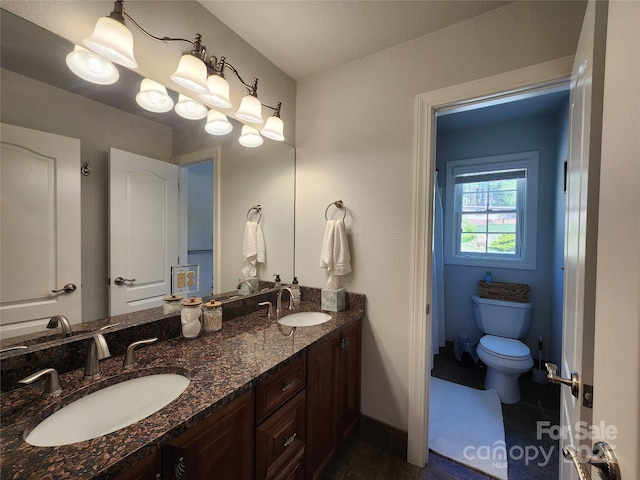 521 Hobson Rd, Bakersville, NC 28705 - bathroom with double vanity, toilet, and baseboards