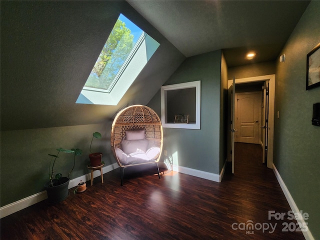 521 Hobson Rd, Bakersville, NC 28705 - sitting room featuring a skylight, lofted ceiling, wood finished floors, and baseboards
