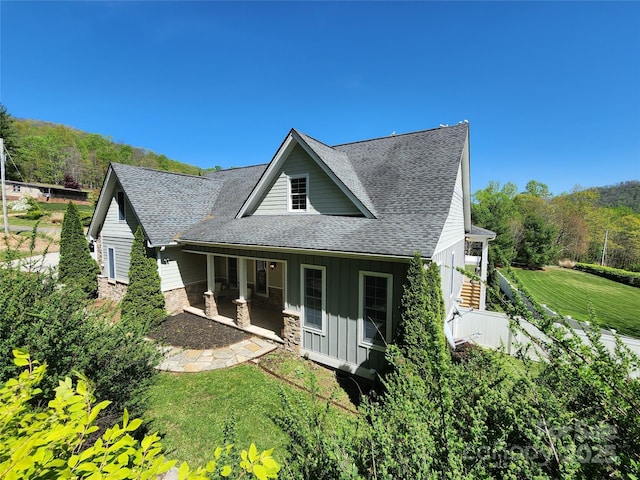 521 Hobson Rd, Bakersville, NC 28705 - view of front of house with roof with shingles, board and batten siding, and a front yard