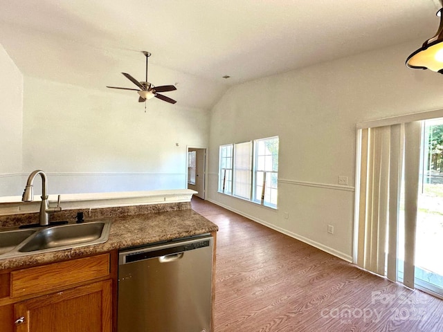 8551 Appledale Dr, Charlotte, NC 28262 - kitchen with stainless steel dishwasher, a sink, wood finished floors, brown cabinets, and ceiling fan