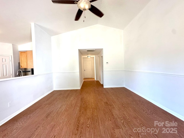 8551 Appledale Dr, Charlotte, NC 28262 - unfurnished room with vaulted ceiling, ceiling fan, wood finished floors, and baseboards
