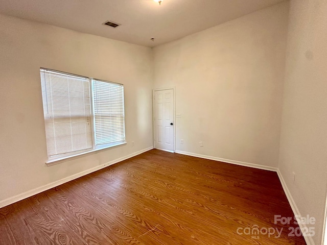 8551 Appledale Dr, Charlotte, NC 28262 - empty room with dark wood-style floors and baseboards