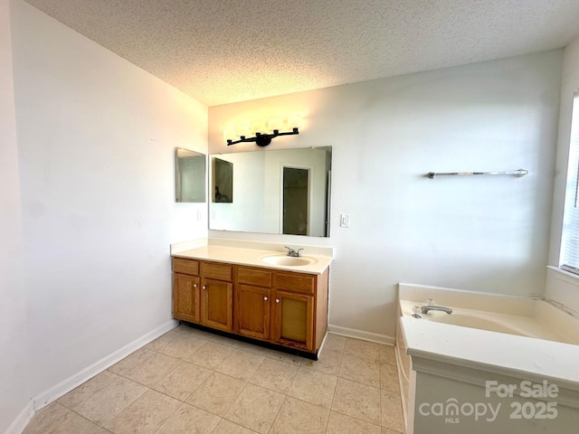 8551 Appledale Dr, Charlotte, NC 28262 - full bathroom with vanity, a garden tub, baseboards, a textured ceiling, and tile patterned flooring