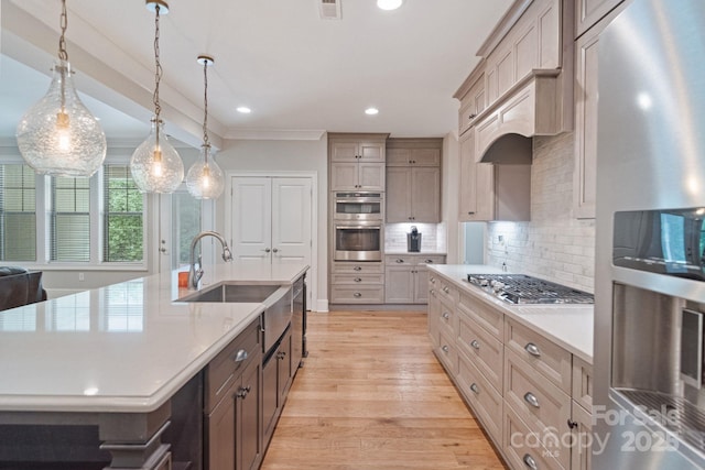 kitchen with appliances with stainless steel finishes, light countertops, light wood-style floors, recessed lighting, and decorative backsplash
