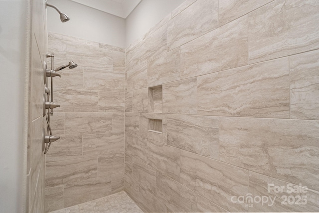 bathroom with tiled shower