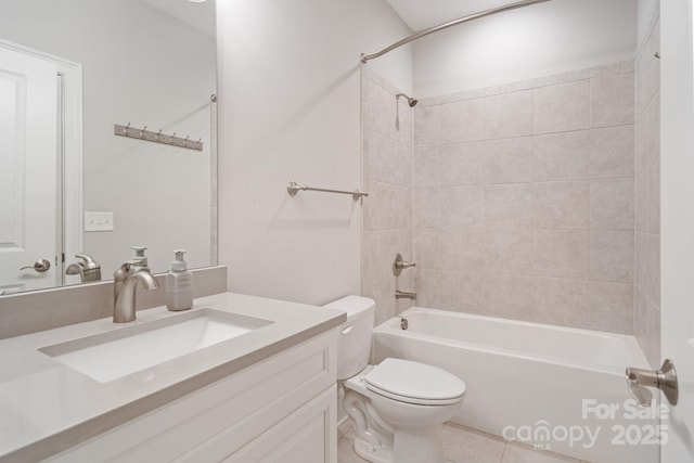 bathroom with toilet, tub / shower combination, vanity, and tile patterned flooring