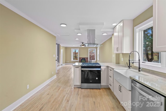 kitchen with stainless steel appliances, white cabinets, island exhaust hood, a peninsula, and open floor plan