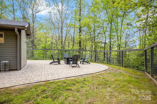 16 Caddis Ct, Marshall, NC 28753 - view of grassy yard featuring a patio and an outdoor fire pit