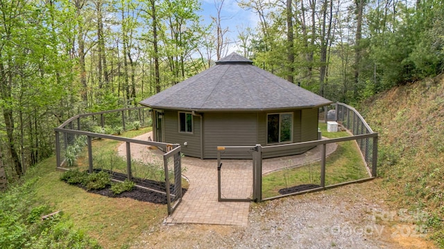 16 Caddis Ct, Marshall, NC 28753 - view of home's exterior with roof with shingles and a forest view