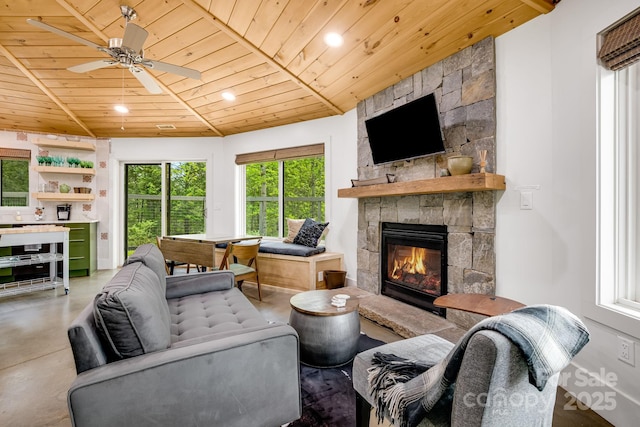 16 Caddis Ct, Marshall, NC 28753 - living area featuring wood ceiling, concrete flooring, a stone fireplace, ceiling fan, and recessed lighting