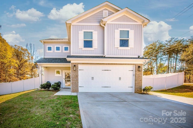 view of front of home with board and batten siding, fence, driveway, and a front lawn