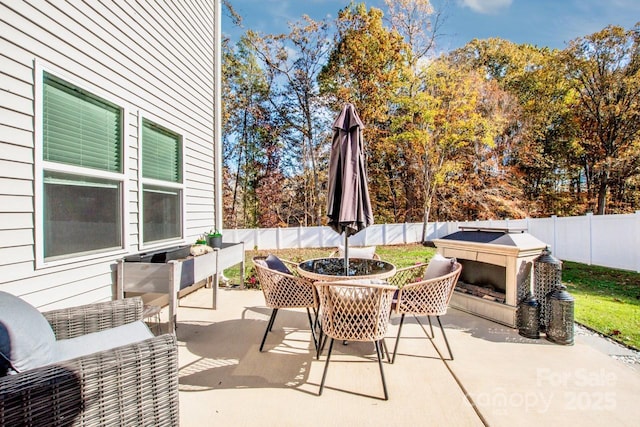 view of patio / terrace with outdoor dining space and a fenced backyard