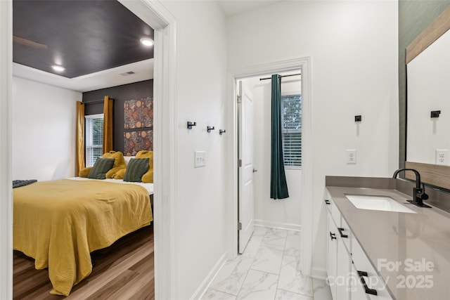 104 Trellis Ln, Troutman, NC 28166 - bedroom with a sink, baseboards, light marble finish flooring, and recessed lighting