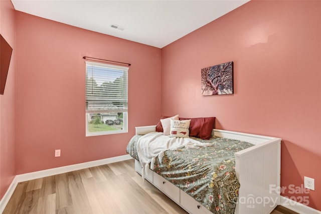 104 Trellis Ln, Troutman, NC 28166 - bedroom with light wood-style flooring and baseboards