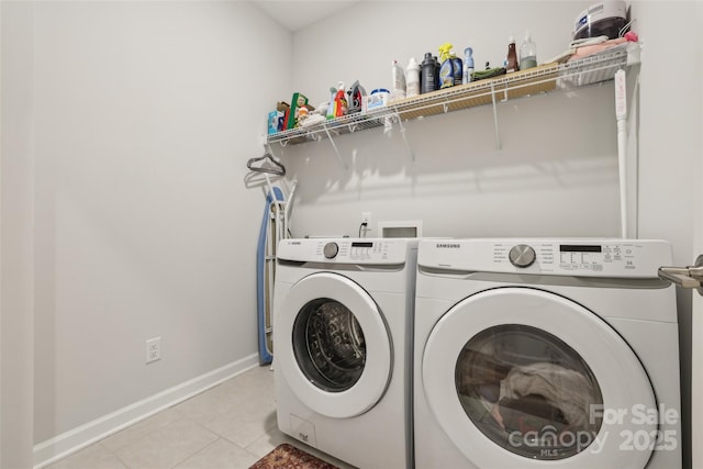 104 Trellis Ln, Troutman, NC 28166 - laundry area featuring independent washer and dryer, light tile patterned floors, and baseboards