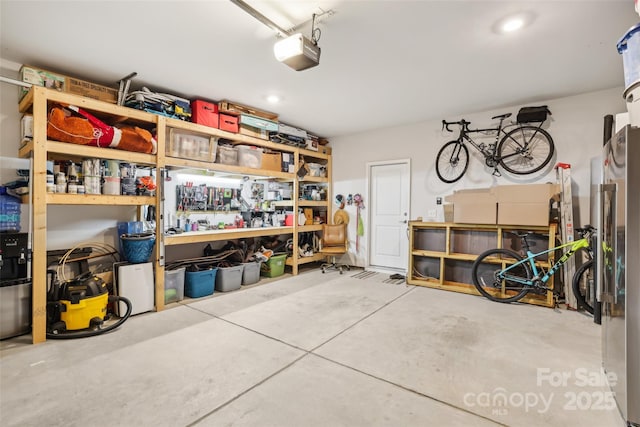 104 Trellis Ln, Troutman, NC 28166 - garage featuring a garage door opener and recessed lighting
