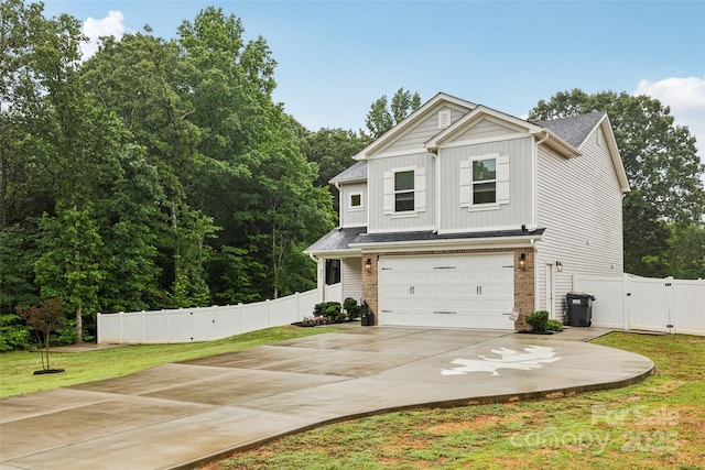 104 Trellis Ln, Troutman, NC 28166 - view of front of property with a gate, a garage, board and batten siding, and driveway