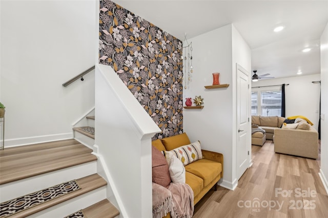 104 Trellis Ln, Troutman, NC 28166 - staircase with wood finished floors, a ceiling fan, baseboards, and recessed lighting