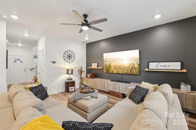 104 Trellis Ln, Troutman, NC 28166 - living area featuring wood finished floors, stairway, ceiling fan, baseboards, and recessed lighting