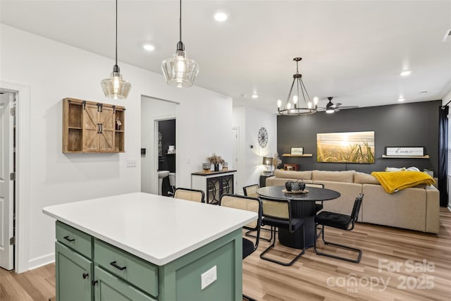 104 Trellis Ln, Troutman, NC 28166 - kitchen featuring green cabinetry, light wood-type flooring, a center island, light countertops, and recessed lighting