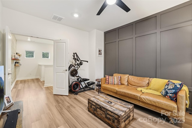 104 Trellis Ln, Troutman, NC 28166 - living area featuring ceiling fan, light wood-style flooring, a decorative wall, and recessed lighting