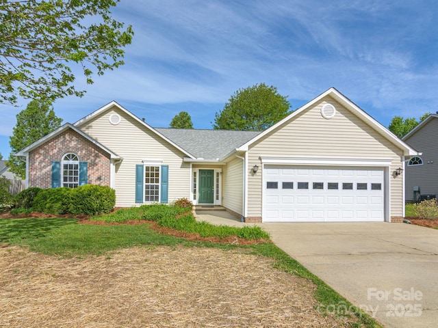 ranch-style home featuring brick siding, an attached garage, and driveway