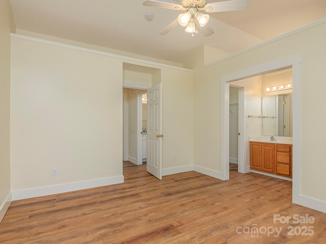 unfurnished bedroom featuring baseboards and light wood-style flooring