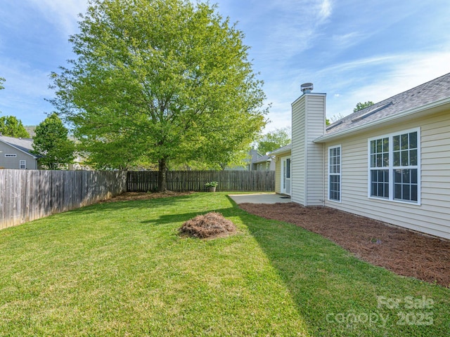 view of yard featuring a fenced backyard and a patio