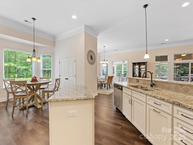 kitchen with a notable chandelier, dishwasher, visible vents, and a sink
