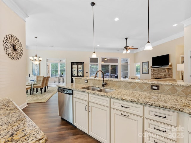 kitchen featuring a sink, crown molding, decorative backsplash, and dishwasher