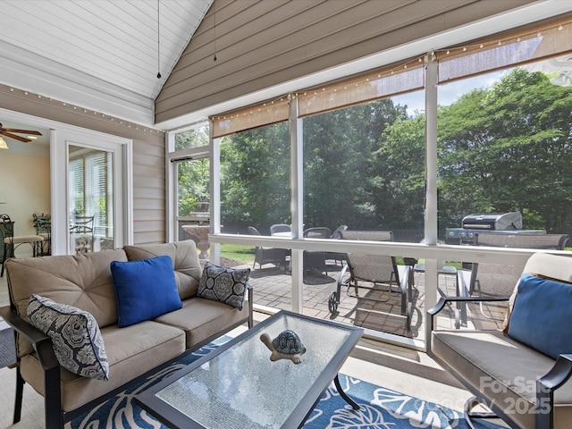 sunroom with an outdoor hangout area, ceiling fan, and outdoor dining space